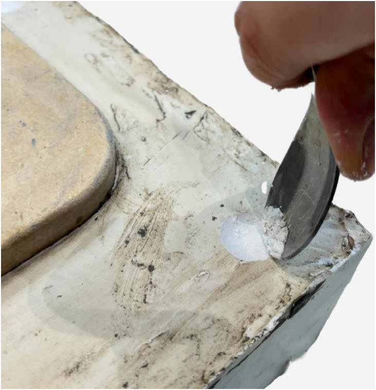 Scraping back the set plaster
