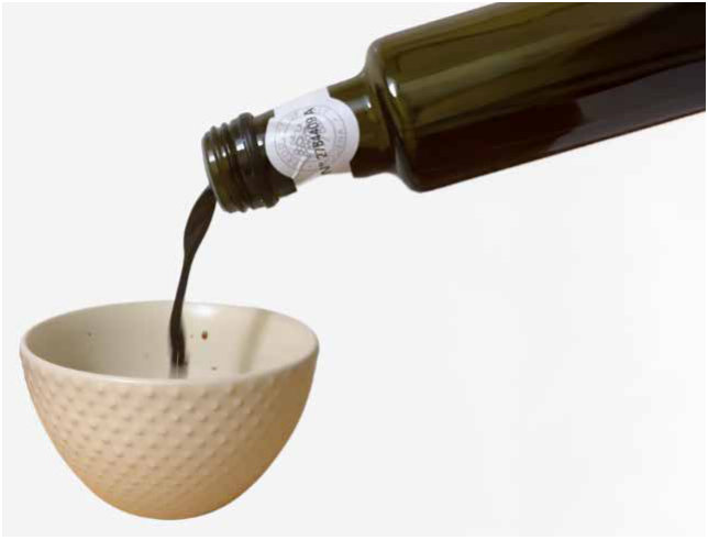 Pouring vinegar from a narrower neck