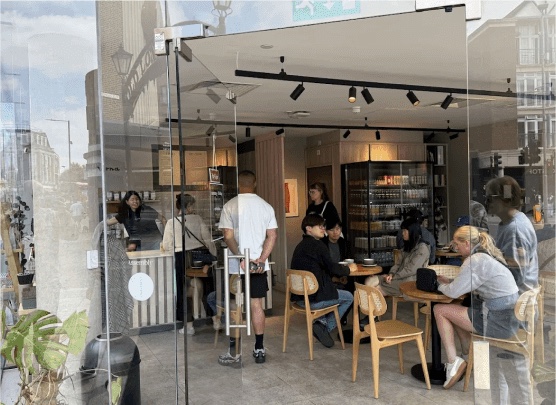 Customers seated inside Marna Coffee
