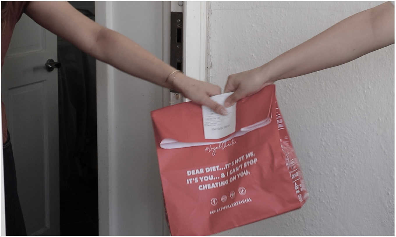 A takeaway bag handed over at the door