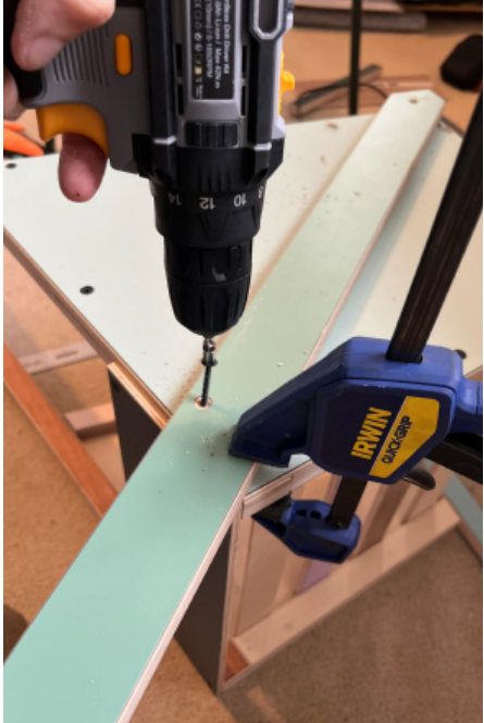 Drilling through a clamped brace