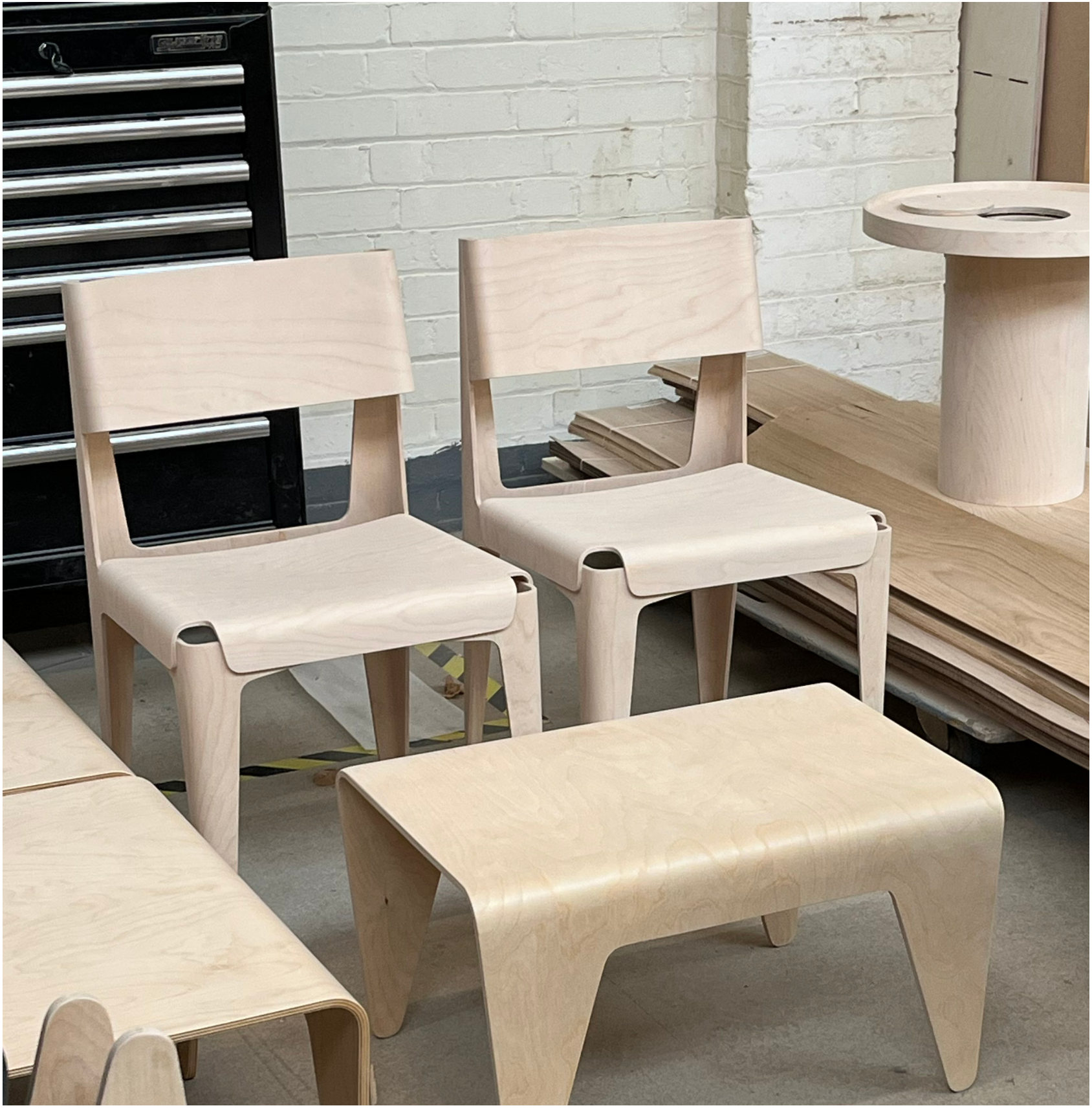 Plywood chairs and a stool in the workshop
