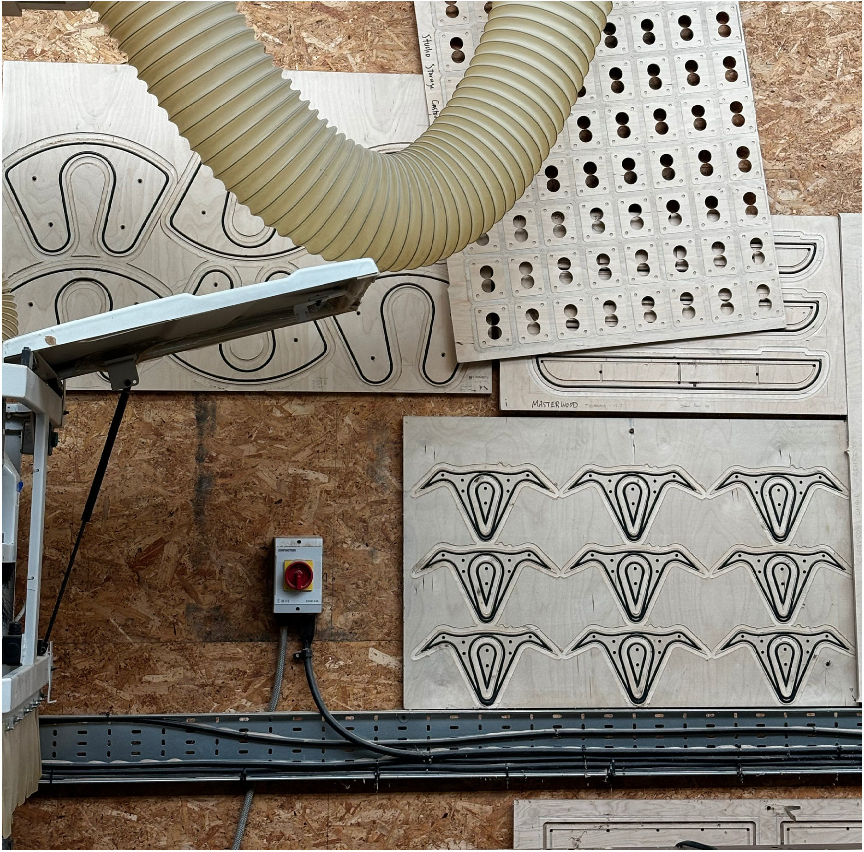 CNC-cut plywood sheets in the workshop