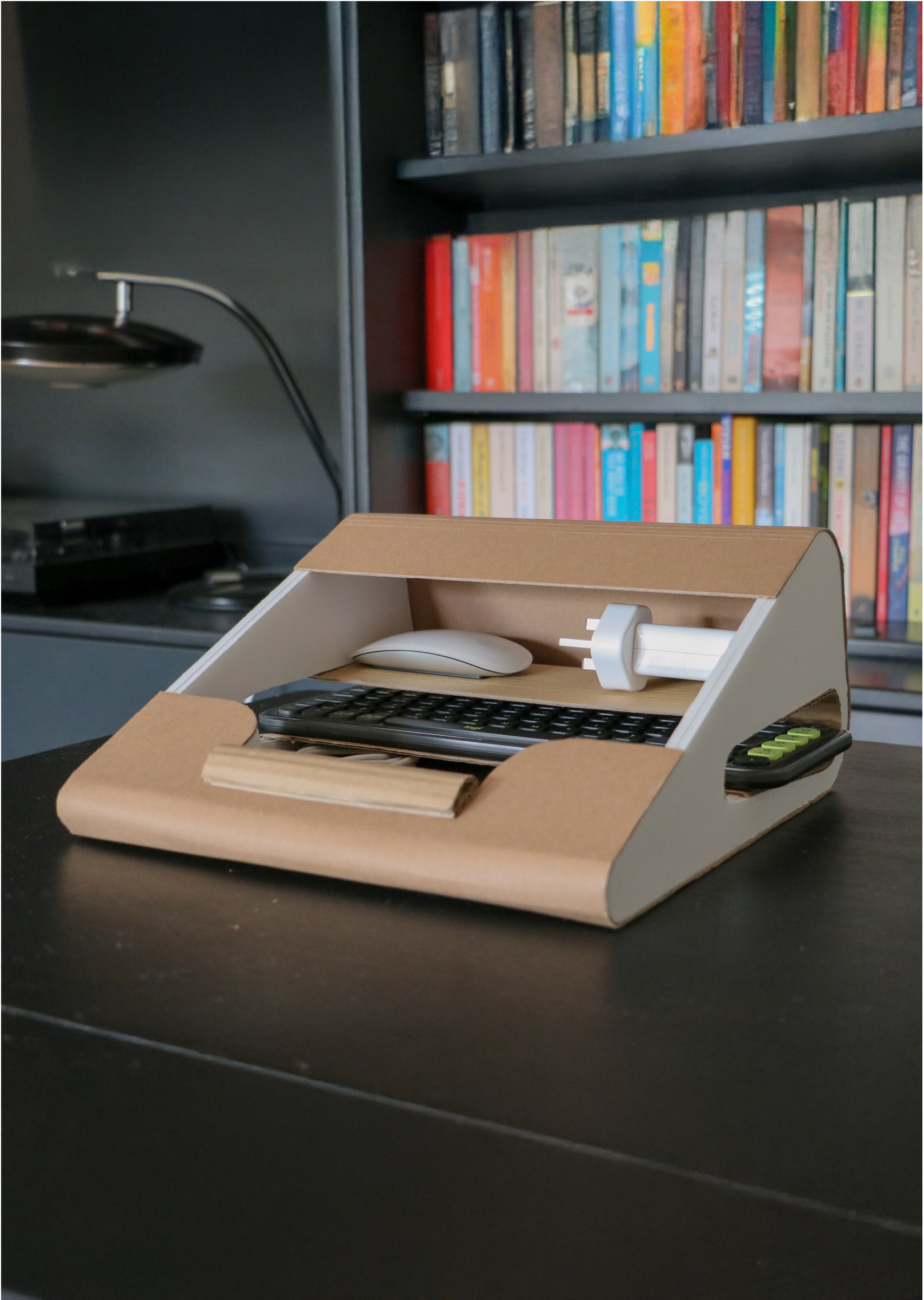 The Port lying flat with a keyboard, mouse and charger stored inside